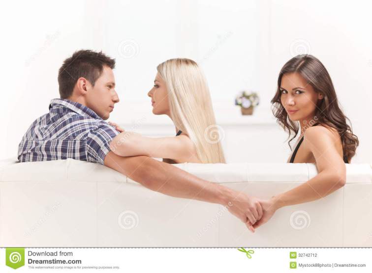 love-triangle-beautiful-young-women-holding-hands-men-sitting-near-his-girlfriend-32742712